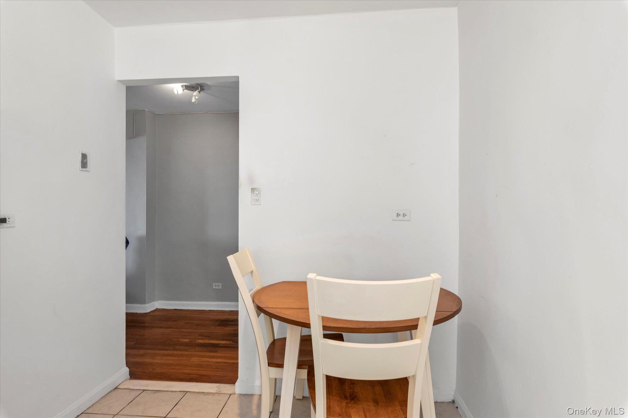 83-40 Austin Street, Unit 7K Queens, NY 11415 - Photo 9 of 19 a view of entryway with wooden floor