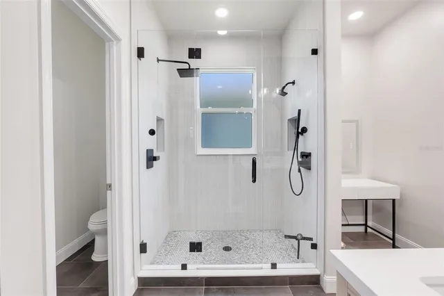 a bathroom with a bathtub and a shower