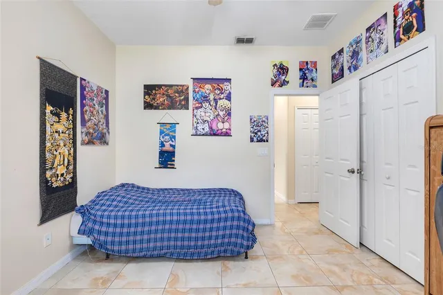 a bedroom with a bed and cabinets