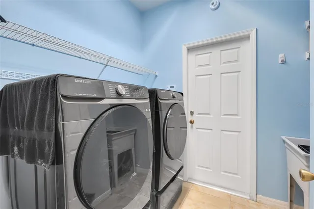 a utility room with dryer and washer