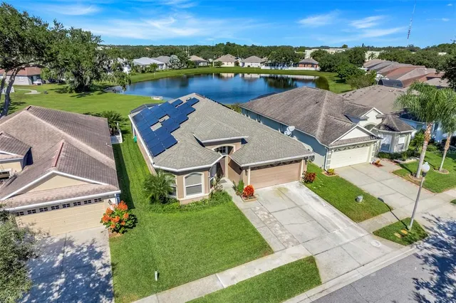 an aerial view of a house with outdoor space