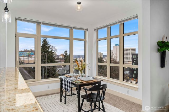a kitchen with granite countertop a sink and a stove top oven
