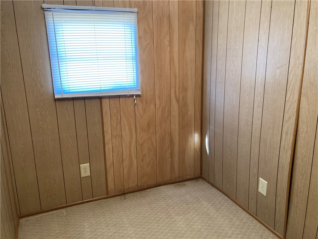 1134 East County Road 2328 Riviera, TX 78379 - Photo 18 of 27 a view of an empty room with a wooden door