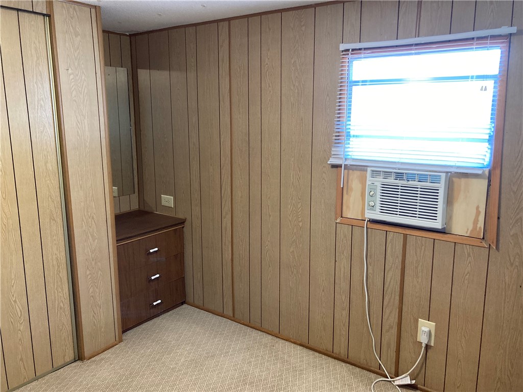 1134 East County Road 2328 Riviera, TX 78379 - Photo 20 of 27 a room with a window and a dresser