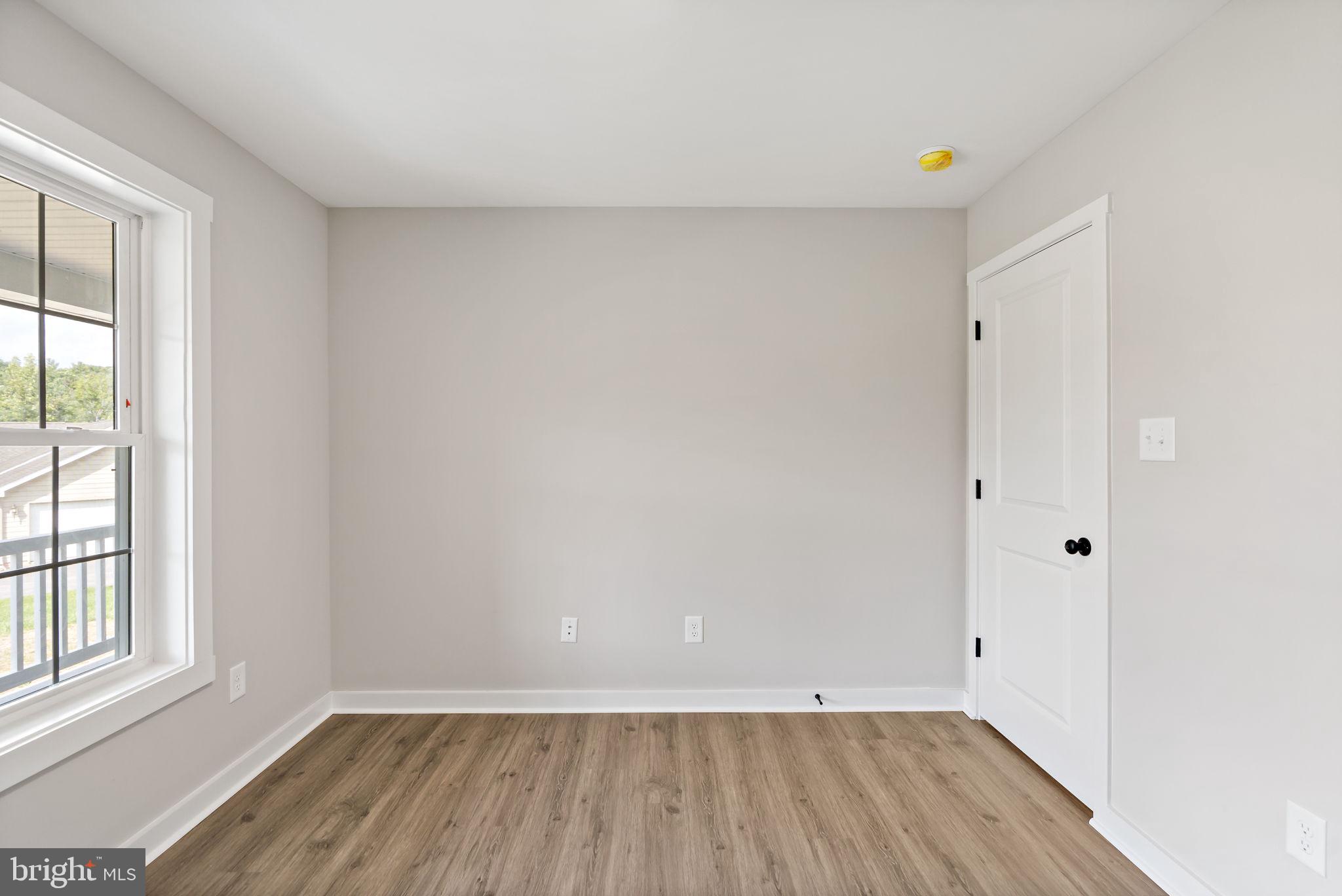 39 Mdg Berkeley Springs Berkeley Springs, WV 25411 - Photo 18 of 46 an empty room with wooden floor and windows