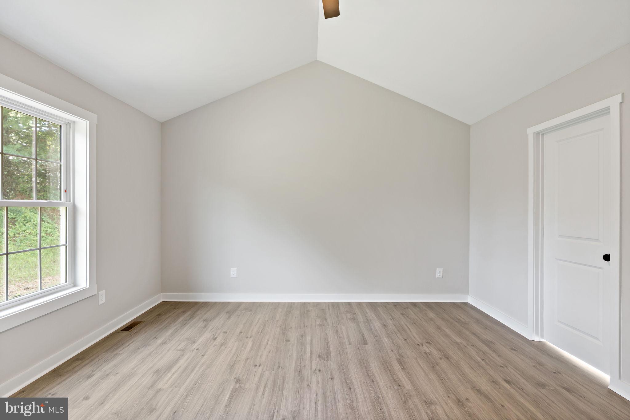 39 Mdg Berkeley Springs Berkeley Springs, WV 25411 - Photo 19 of 46 an empty room with wooden floor and windows