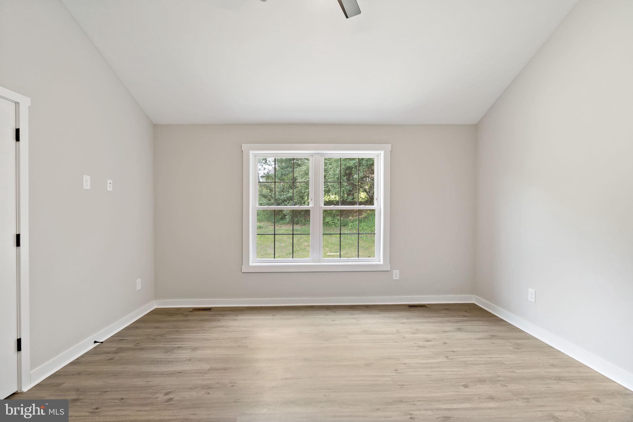 39 Mdg Berkeley Springs Berkeley Springs, WV 25411 - Photo 21 of 46 an empty room with wooden floor and windows