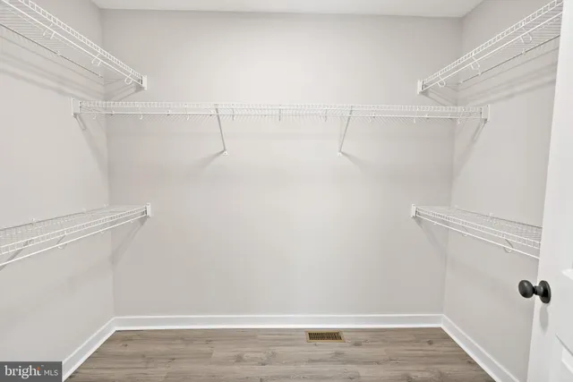 a view of a room with racks on the wall