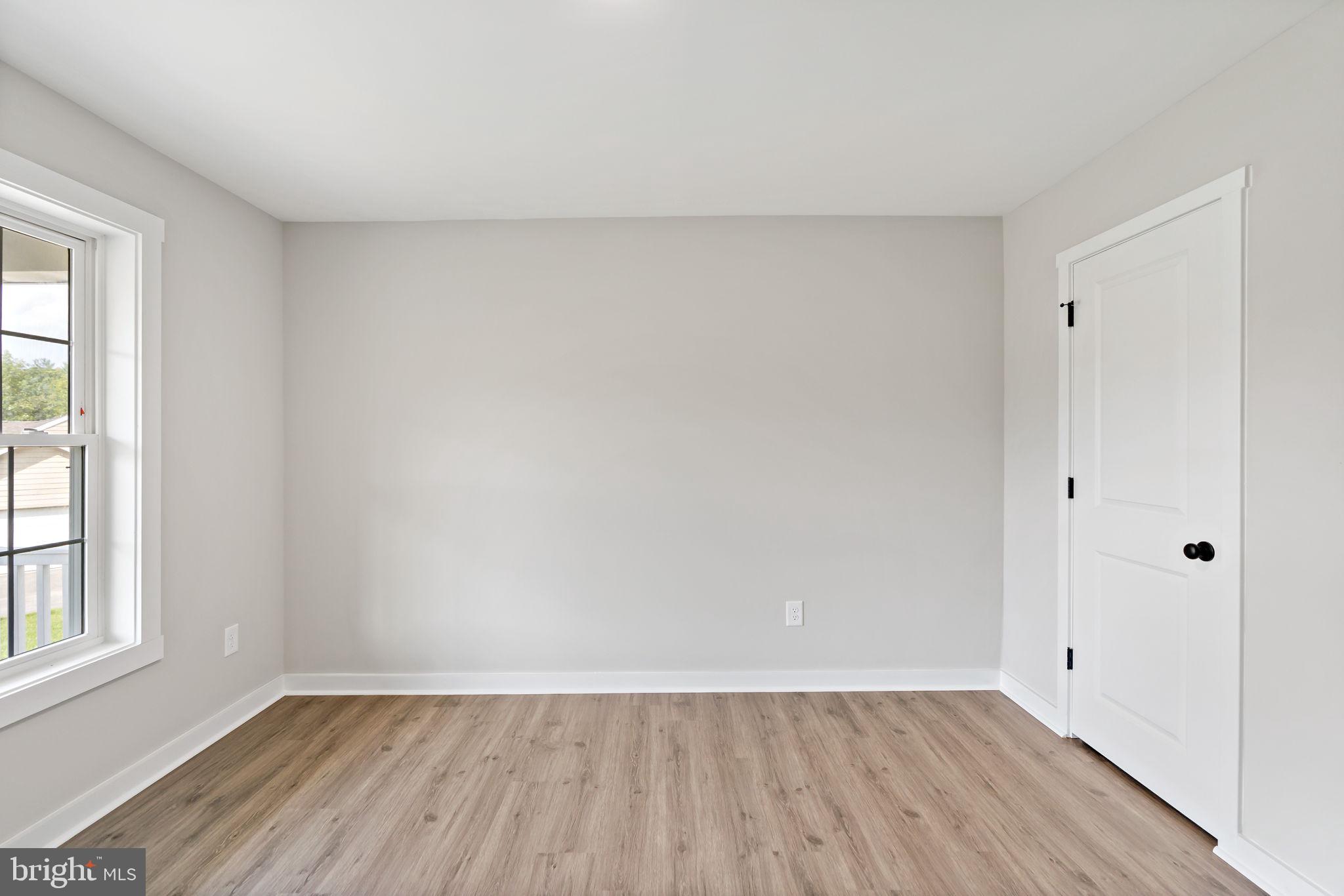 39 Mdg Berkeley Springs Berkeley Springs, WV 25411 - Photo 26 of 46 a view of an empty room with wooden floor and a window