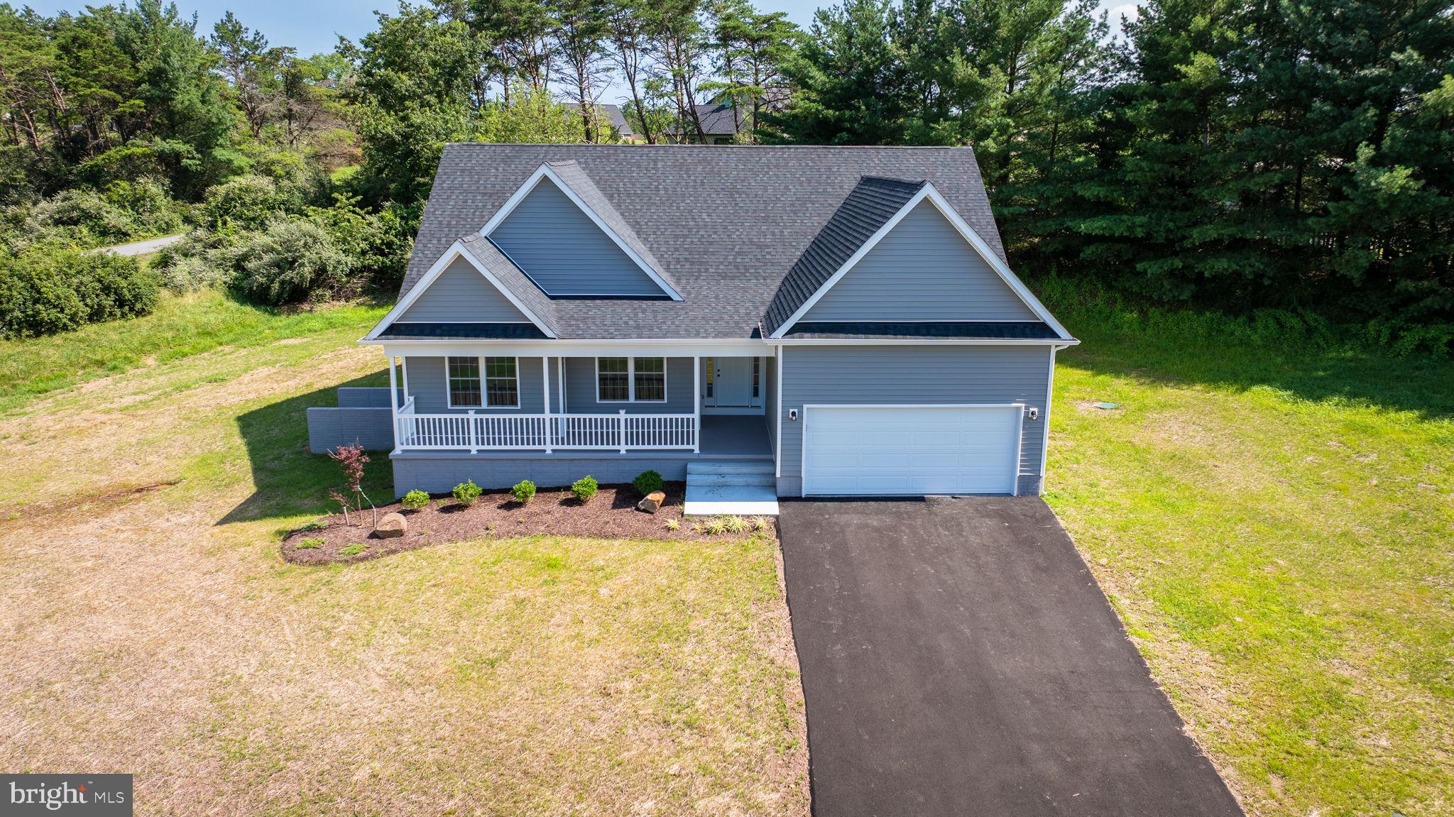 39 Mdg Berkeley Springs Berkeley Springs, WV 25411 - Photo 33 of 46 a front view of house with yard and trees in the background