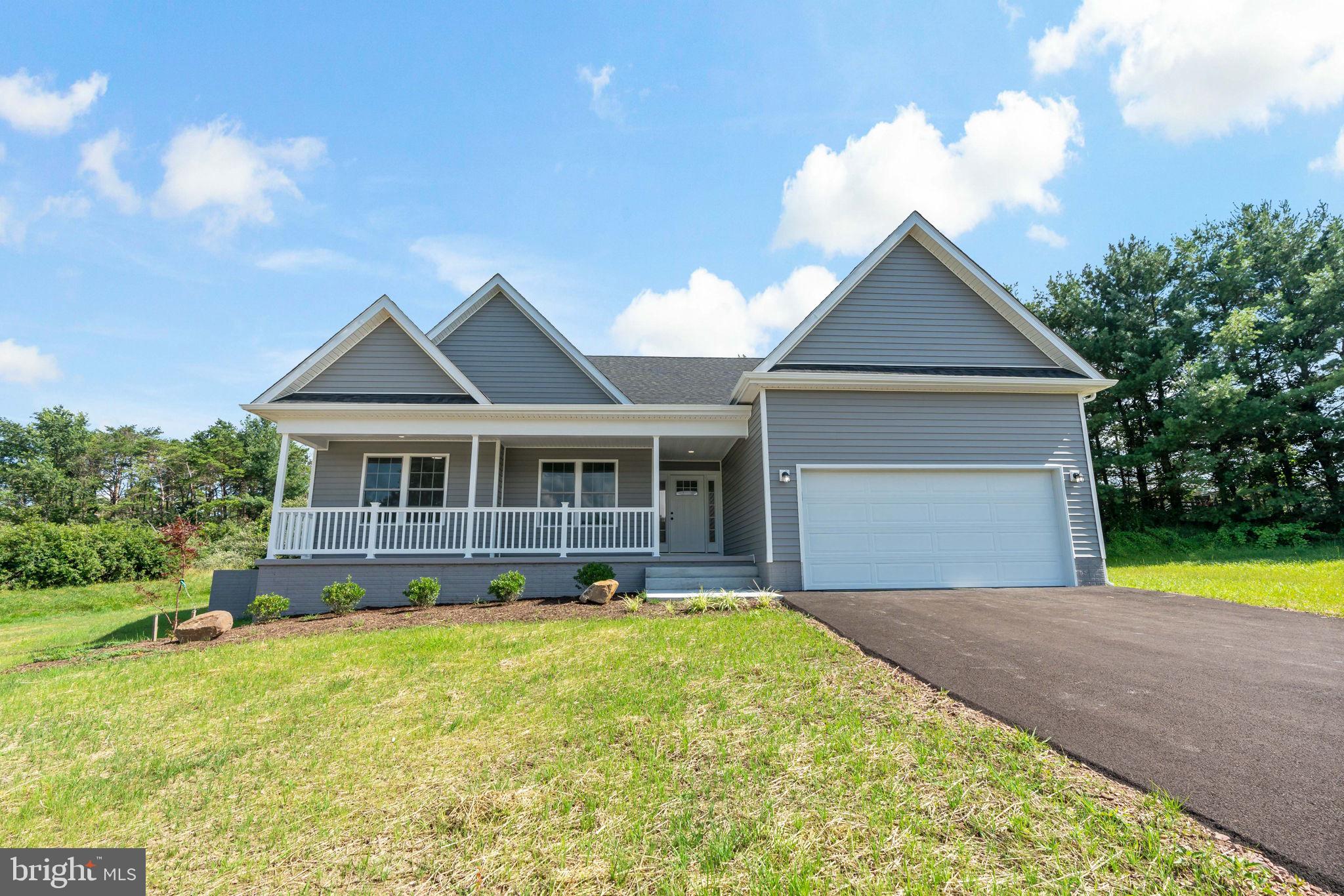 39 Mdg Berkeley Springs Berkeley Springs, WV 25411 - Photo 40 of 46 a front view of a house with a yard and trees