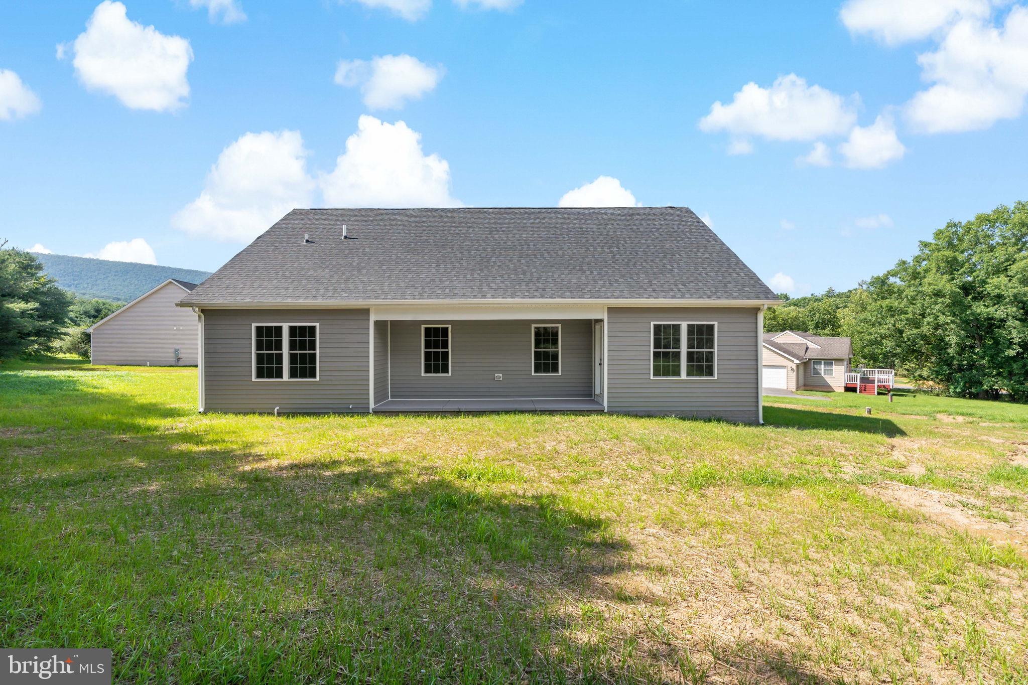 39 Mdg Berkeley Springs Berkeley Springs, WV 25411 - Photo 41 of 46 a view of a house with backyard and a garden