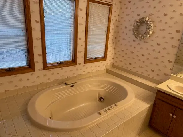a bathroom with a shower and a mirror