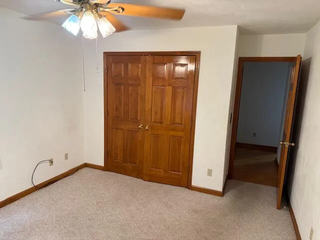 an empty room with closet area
