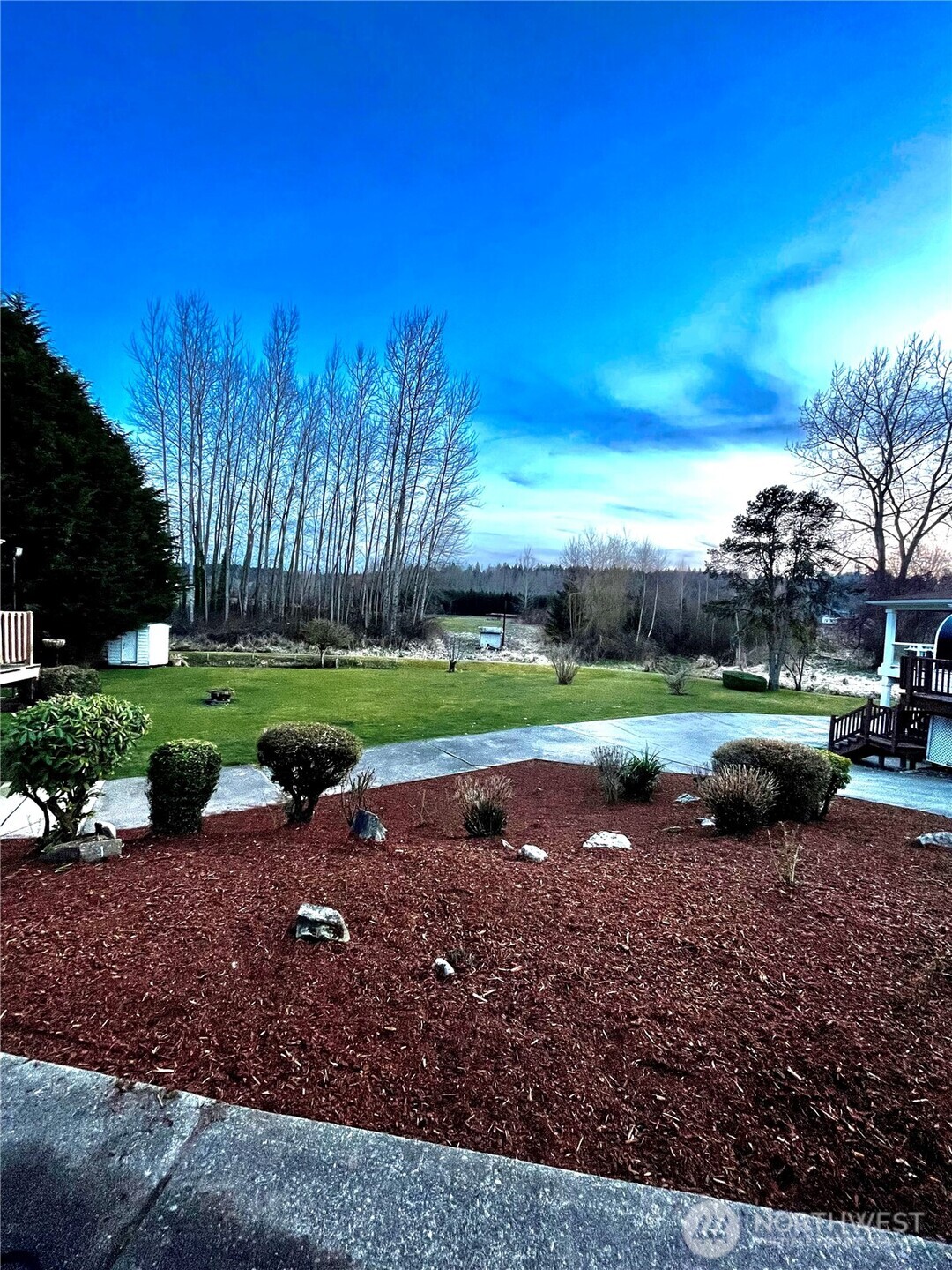 2322 Tacoma Road East, Unit 11 Puyallup, WA 98371 - Photo 15 of 15 a view of a lake with a yard and green space