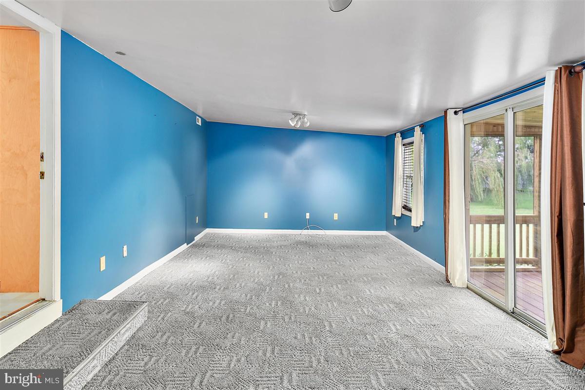 31388 Melson Road Delmar, MD 21875 - Photo 7 of 38 Family Room leads to enclosed porch