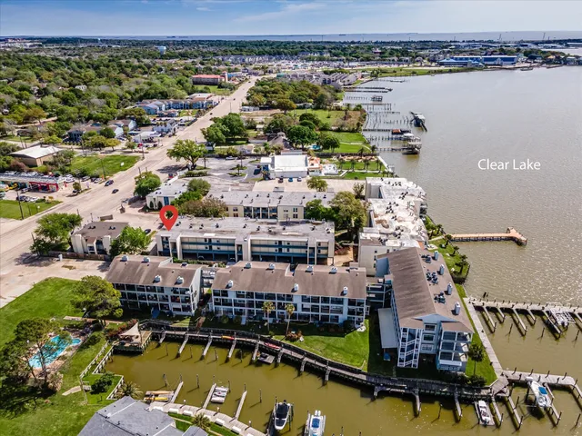 an aerial view of a house with lake view