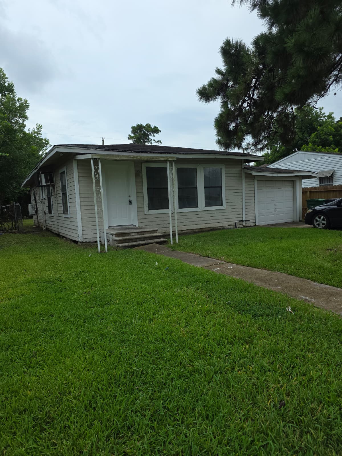 242 Bolden Street Houston, TX 77029 - Photo 1 of 24 a view of a backyard with a garden