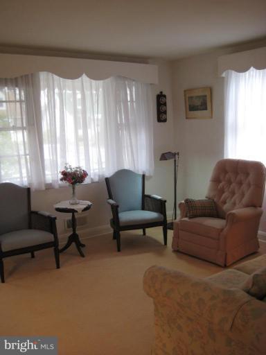 8120 Hillendale Road Parkville, MD 21234 - Photo 3 of 16 a living room with furniture and a potted plant