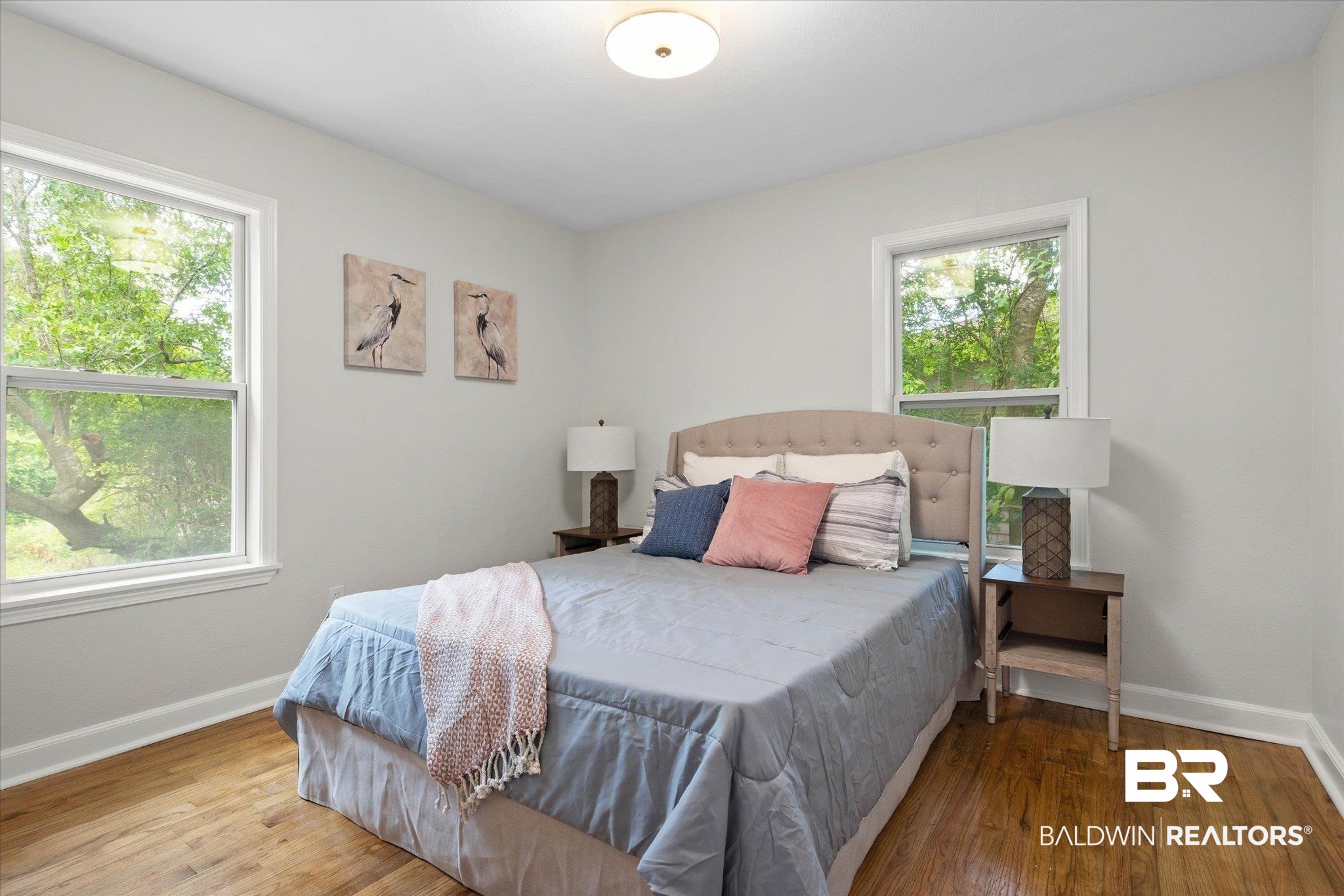 3512 Spring Hill Avenue Mobile, AL 36608 - Photo 16 of 20 Bedroom with multiple windows and wood finished floors