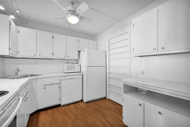 a view of cabinets and wooden floor