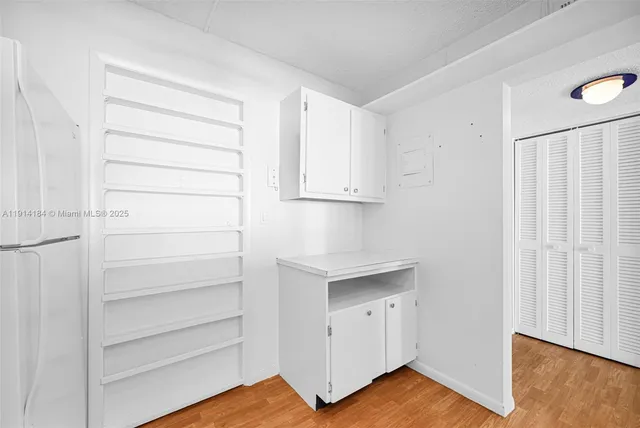 a bathroom with a sink a mirror a shower and a sink