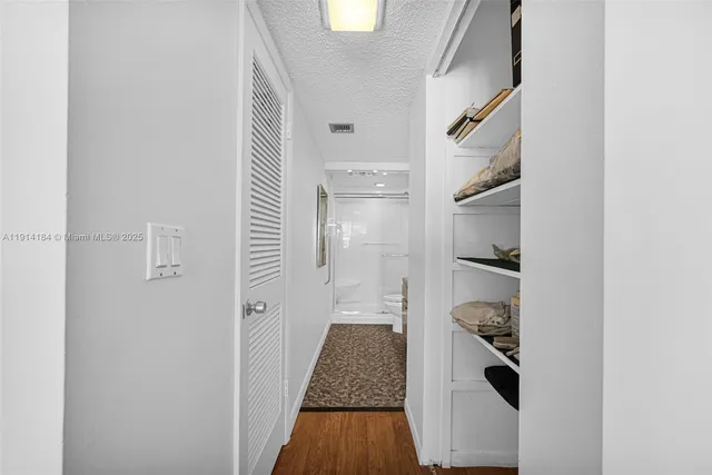 a view of a balcony dining table and chairs
