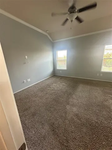 en empty room with windows and closet