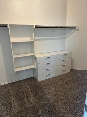 a view of an empty walk in closet