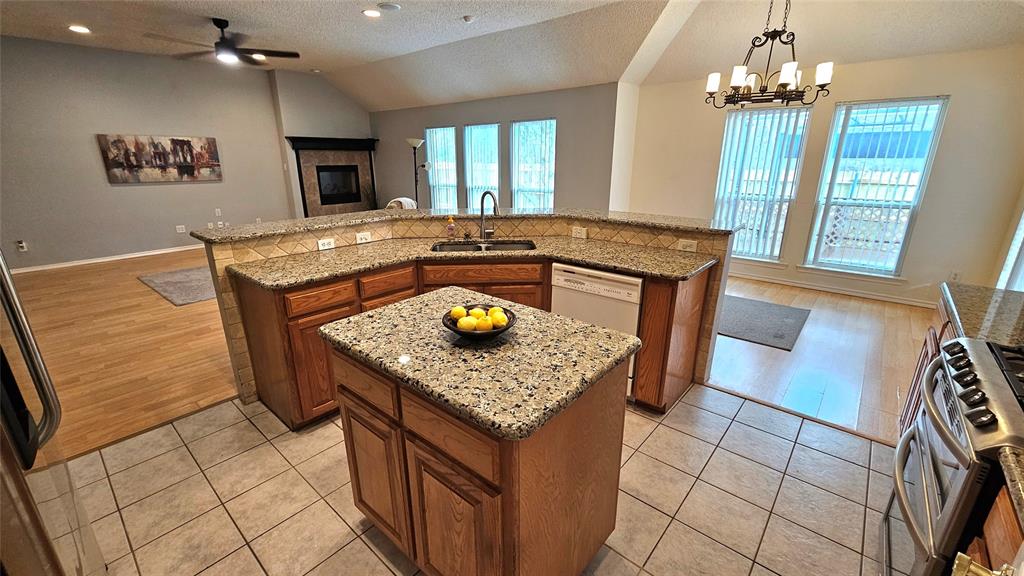 7529 Whitestone Ranch Road Benbrook, TX 76126 - Photo 12 of 26 a kitchen with a sink appliances and a counter top space