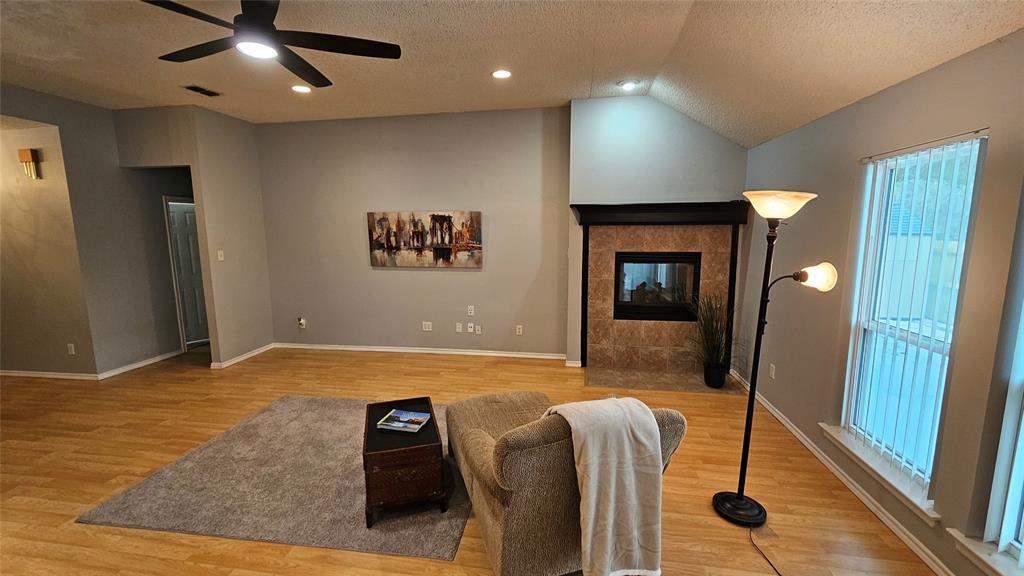 7529 Whitestone Ranch Road Benbrook, TX 76126 - Photo 15 of 26 a living room with furniture and a flat screen tv