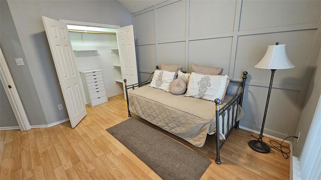 7529 Whitestone Ranch Road Benbrook, TX 76126 - Photo 17 of 26 a bedroom with a bed and a mirror