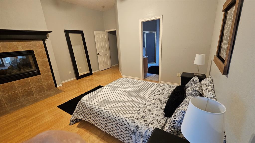 7529 Whitestone Ranch Road Benbrook, TX 76126 - Photo 20 of 26 a bedroom with a bed and a flat tv screen on the dresser
