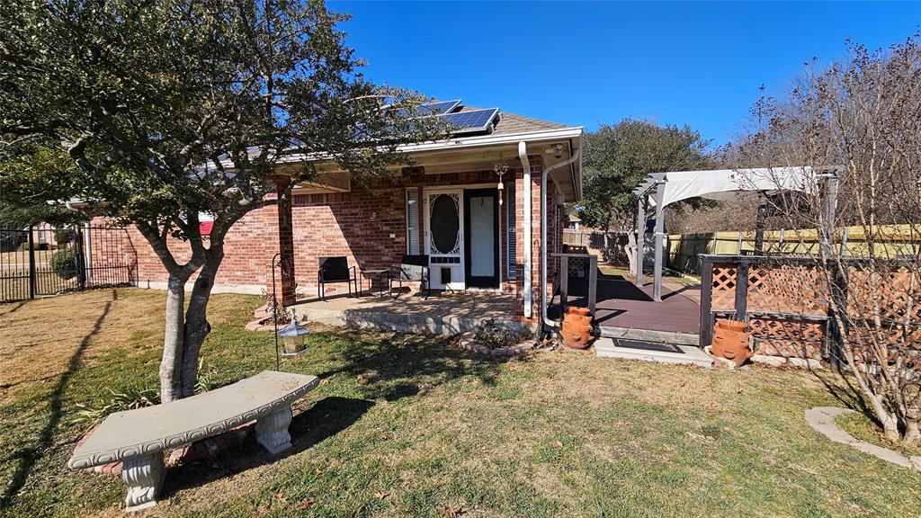 7529 Whitestone Ranch Road Benbrook, TX 76126 - Photo 2 of 26 a view of a chairs and table in the patio