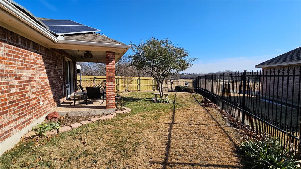 7529 Whitestone Ranch Road Benbrook, TX 76126 - Photo 3 of 26 a view of a balcony with two chairs and a table