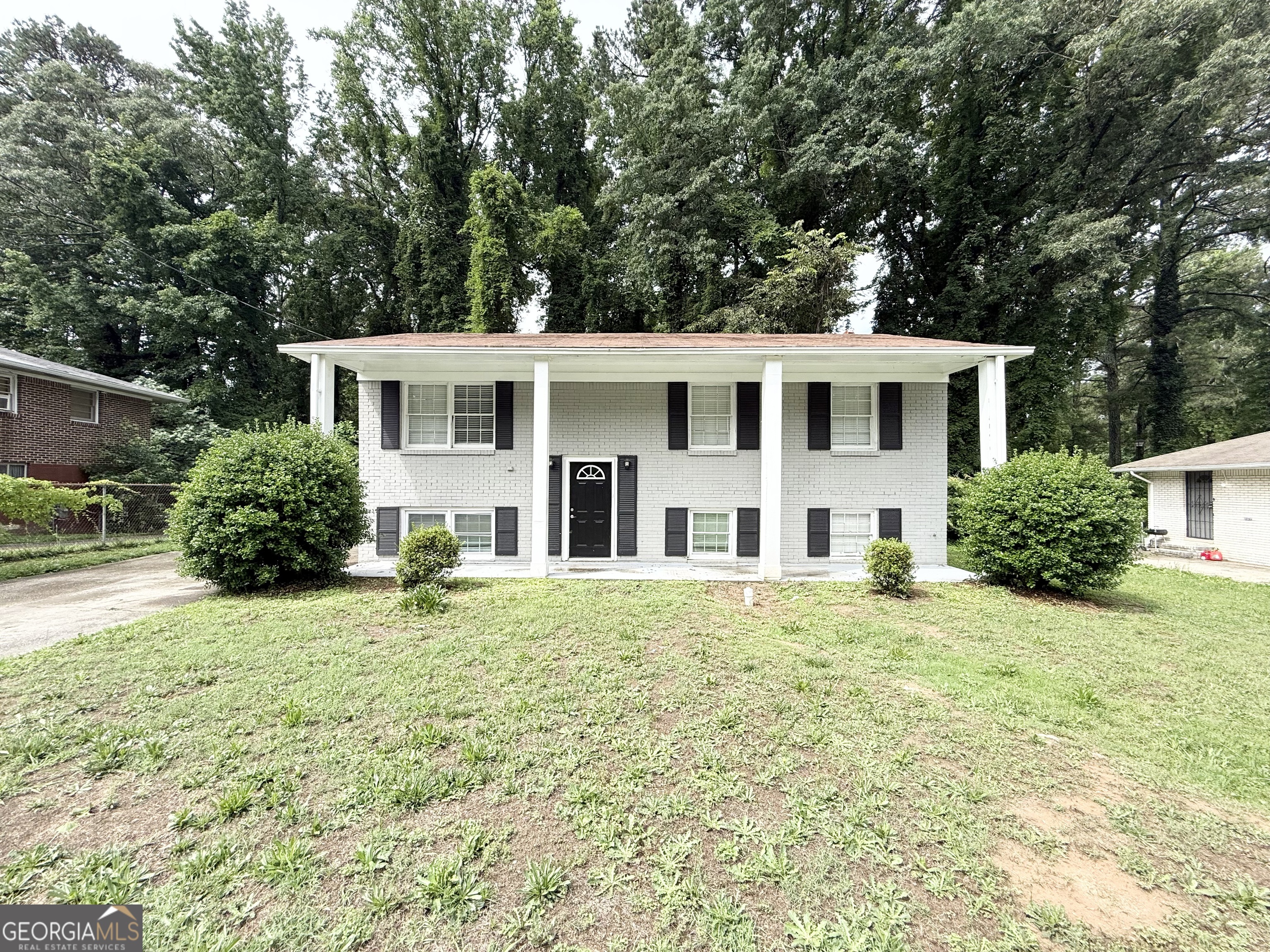 2782 Ocean Valley Road Atlanta, GA 30349 - Photo 2 of 27 front view of a house with a yard