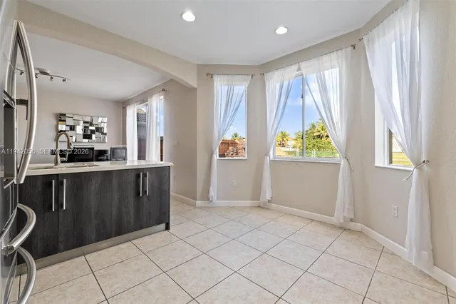 a view of a kitchen with furniture and window