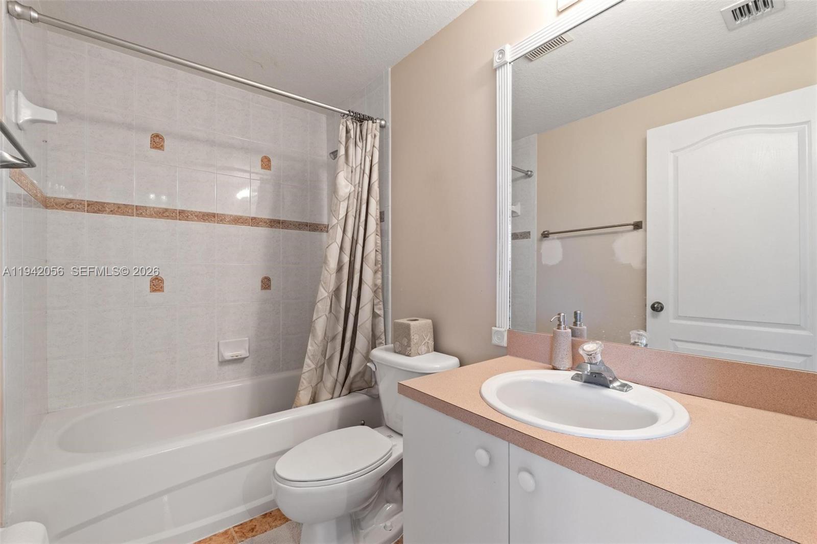 16301 Southwest 70th Street Miami, FL 33193 - Photo 22 of 56 a bathroom with a sink toilet and shower