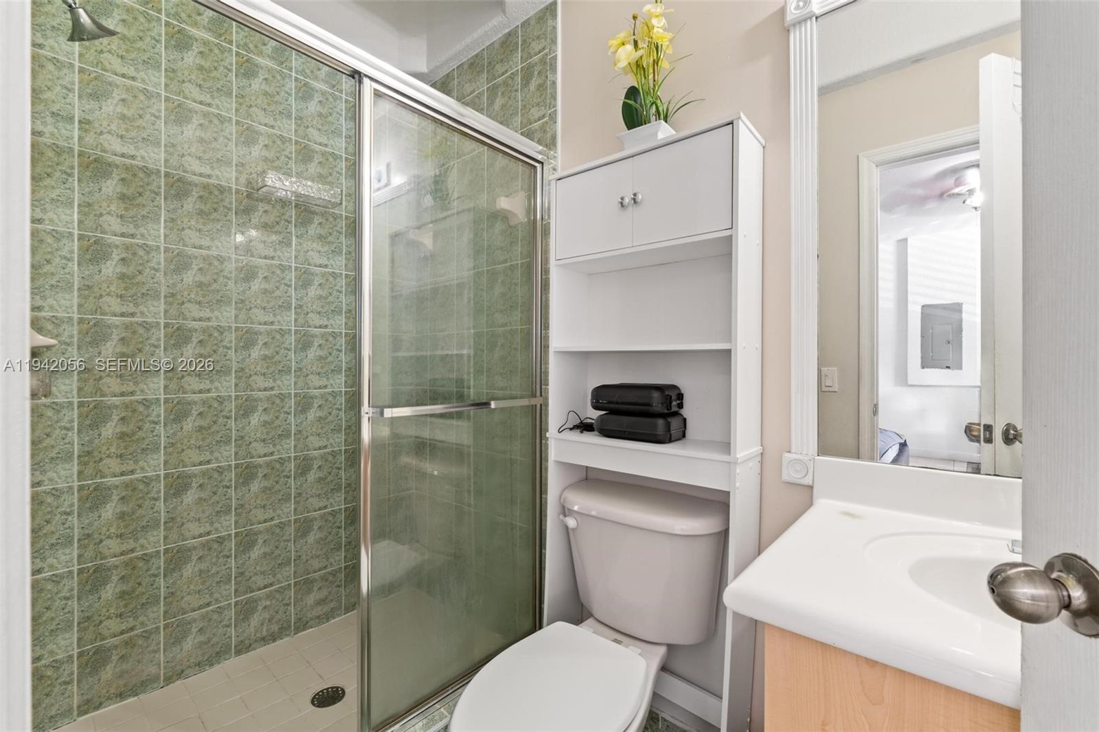 16301 Southwest 70th Street Miami, FL 33193 - Photo 26 of 56 a bathroom with a sink a toilet and shower