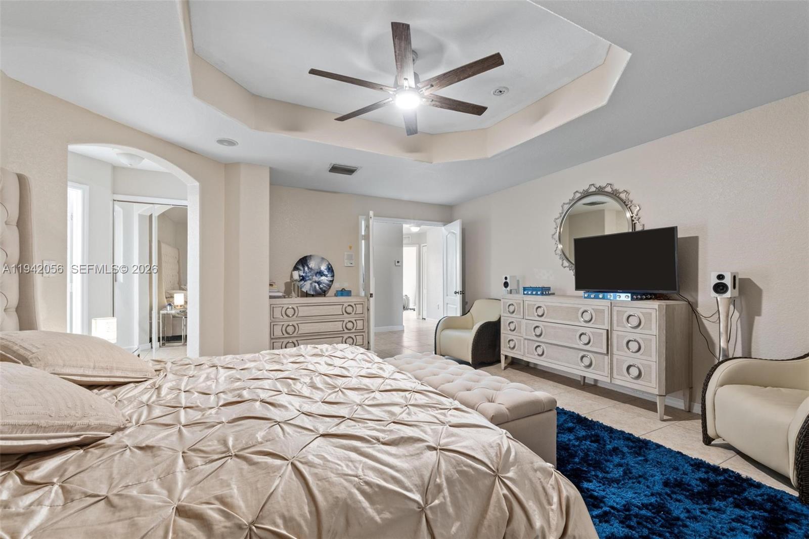 16301 Southwest 70th Street Miami, FL 33193 - Photo 29 of 56 a bedroom with a large bed and a tv