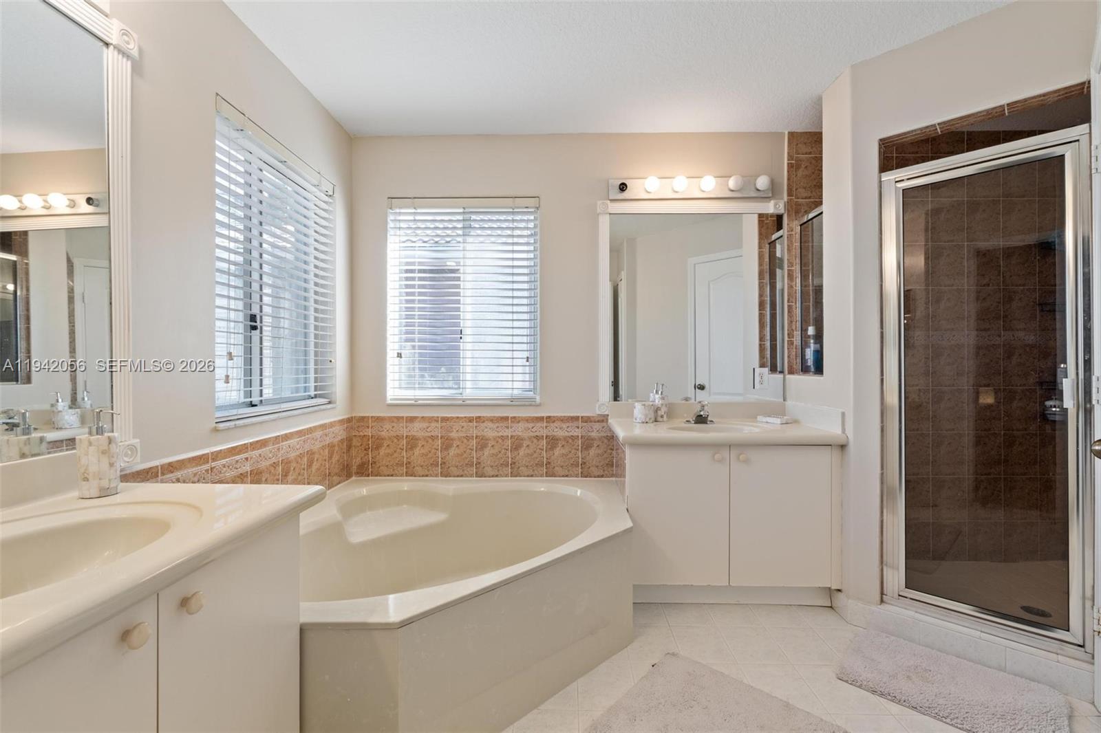 16301 Southwest 70th Street Miami, FL 33193 - Photo 31 of 56 a bathroom with sink shower and bathtub