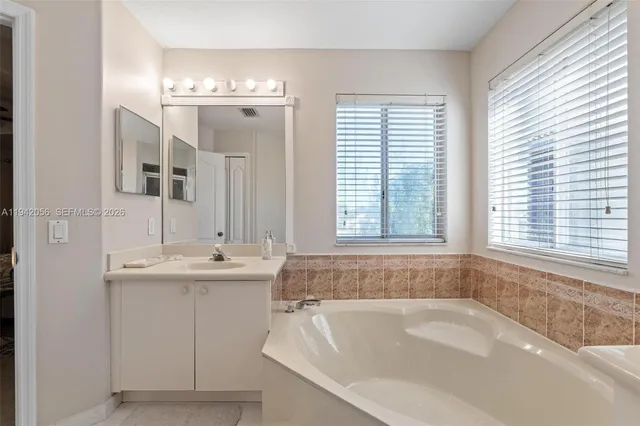 a white toilet sitting next to a white walls