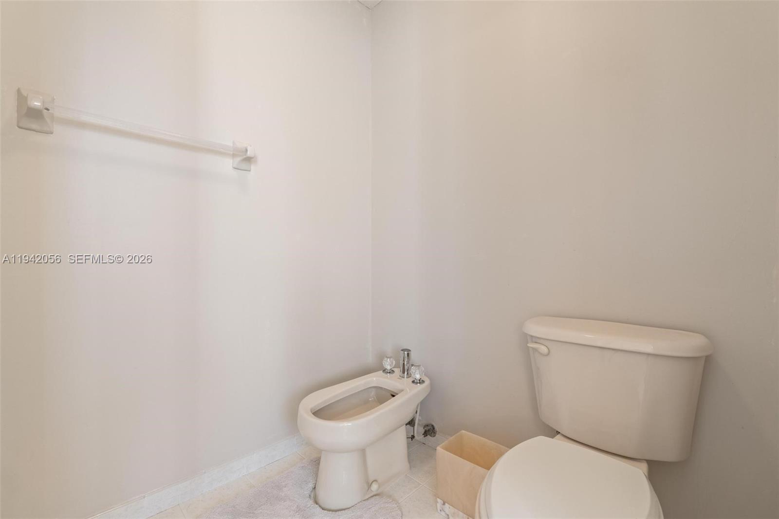 16301 Southwest 70th Street Miami, FL 33193 - Photo 34 of 56 a white toilet sitting next to a white walls