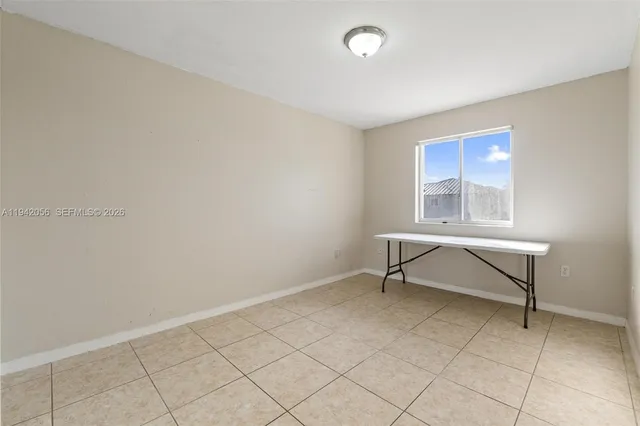 a view of a hallway with windows