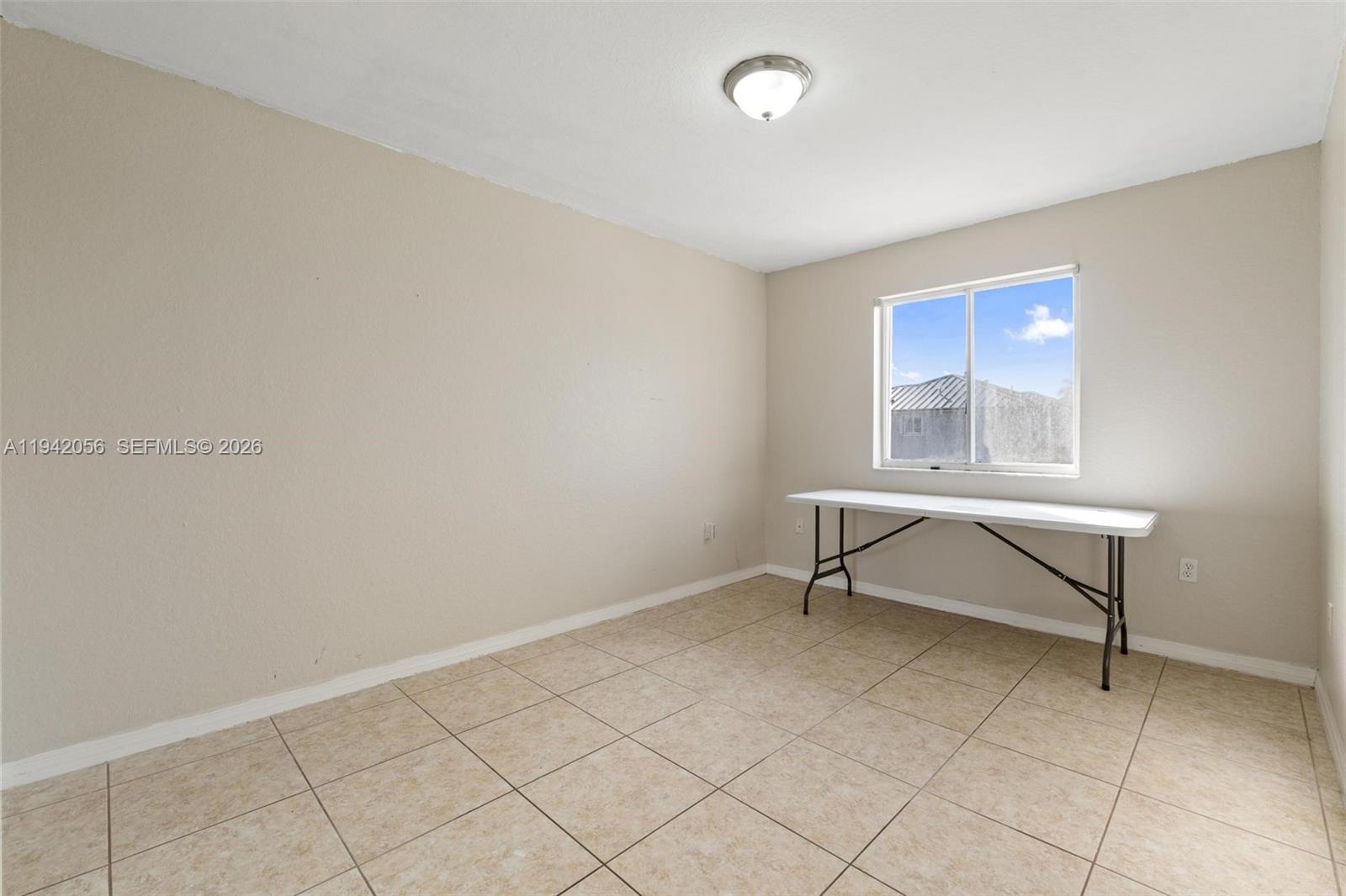 16301 Southwest 70th Street Miami, FL 33193 - Photo 35 of 56 an empty room with windows