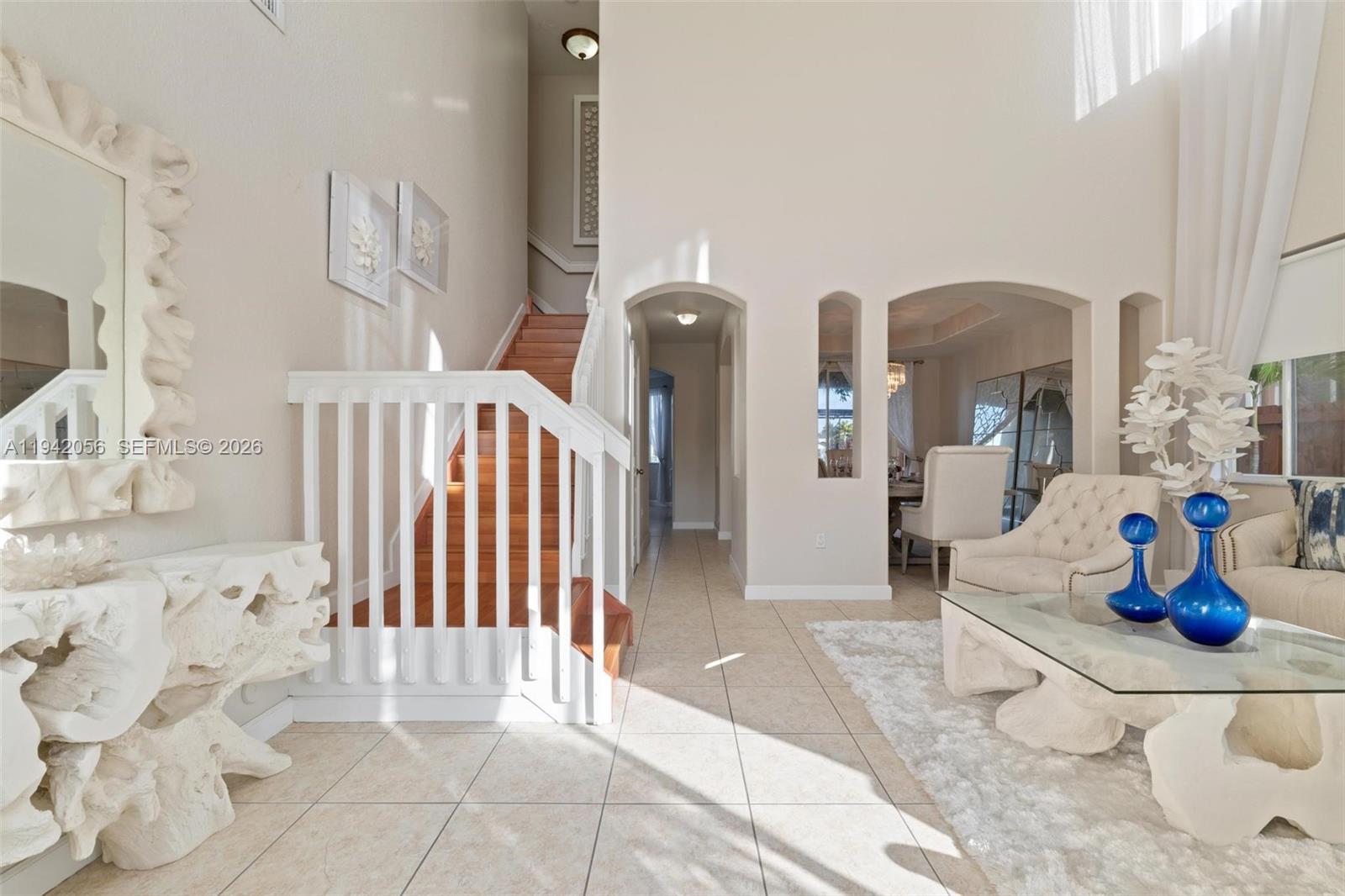 16301 Southwest 70th Street Miami, FL 33193 - Photo 4 of 56 a bedroom with furniture and view of living room