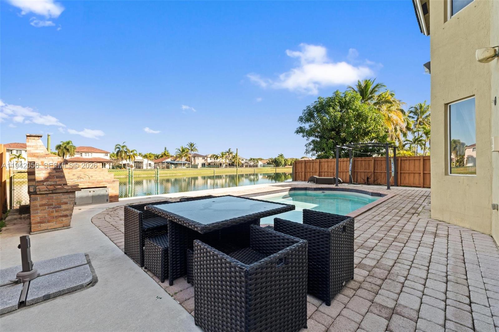 16301 Southwest 70th Street Miami, FL 33193 - Photo 42 of 56 a view of a patio with swimming pool