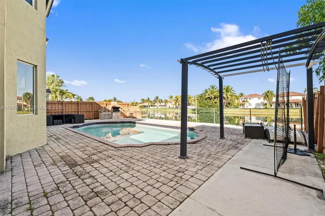 an aerial view of a house with outdoor space