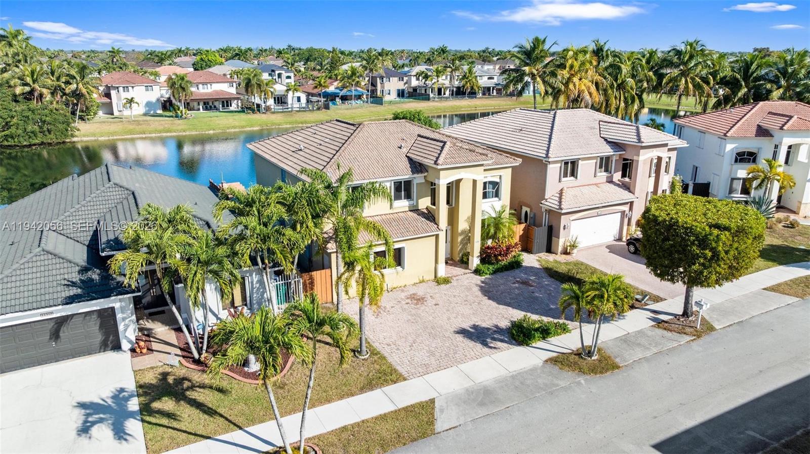 16301 Southwest 70th Street Miami, FL 33193 - Photo 52 of 56 a view of a houses with a yard and chair