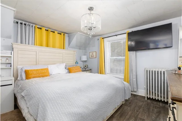 a bedroom with bed and window